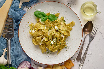 Image showing Tasty tagliatelle pasta with basil and green pesto