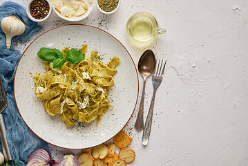 Image showing Tasty tagliatelle pasta with basil and green pesto