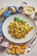 Image showing Tasty tagliatelle pasta with basil and green pesto