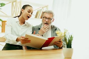 Image showing A daughter or granddaughter spends time with the grandfather