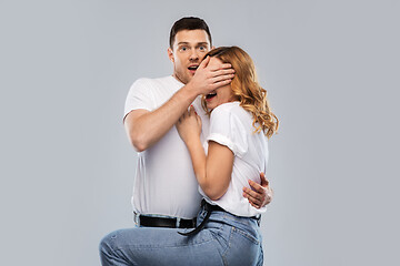 Image showing scared couple in white t-shirts