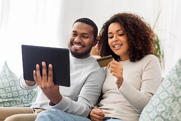 Image showing couple with tablet pc and credit card at home