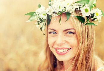 Image showing happy woman in wreath of flowers