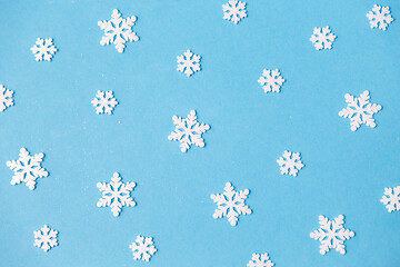 Image showing white snowflake decorations on blue background