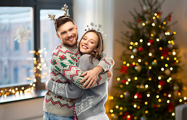 Image showing happy couple at christmas ugly sweater party