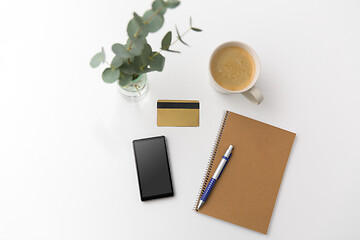 Image showing smartphone, credit card, notebook and coffee