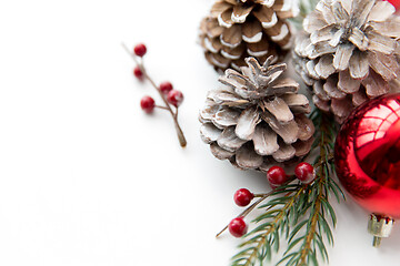 Image showing christmas balls and fir branches with pine cones