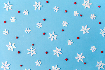 Image showing white snowflakes and berries on blue background