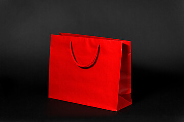 Image showing red shopping bag on black background