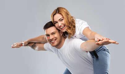 Image showing happy couple in white t-shirts having fun