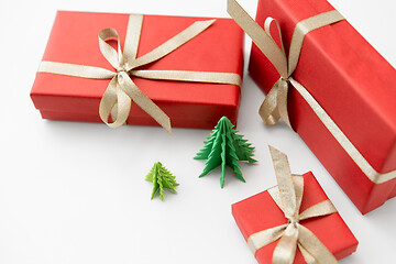 Image showing gift boxes and christmas trees on white background