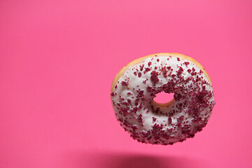 Image showing Macro shoot of donut on pink