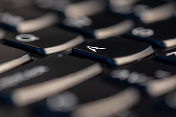 Image showing Macro shot of black keyboard focus on A key