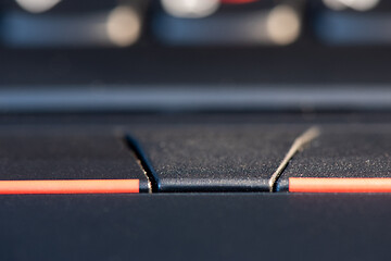Image showing Macro shot of black keyboard focus on touchpad