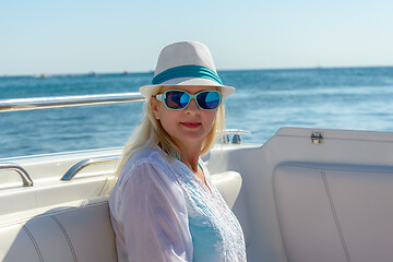 Image showing Blonde in a hat and sunglasses