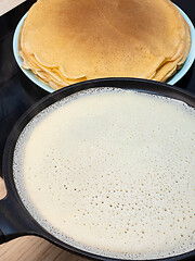 Image showing Cooking pancakes on hot frying pan