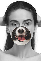 Image showing Contemporary artwork collage concept. Portrait of woman with pet\'s tongue sticked out, bw style