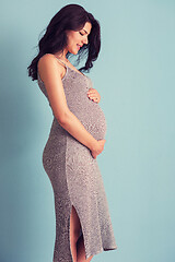 Image showing Portrait of pregnant woman over blue background