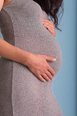 Image showing Portrait of pregnant woman over blue background