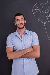 Image showing portrait of man in front of black chalkboard