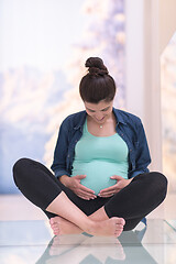 Image showing pregnant women sitting on the floor