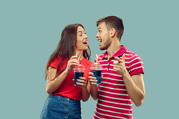 Image showing Beautiful couple isolated on blue studio background