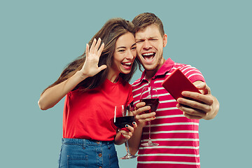 Image showing Beautiful couple isolated on blue studio background