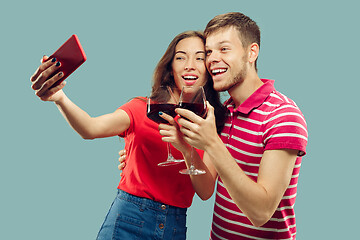 Image showing Beautiful couple isolated on blue studio background