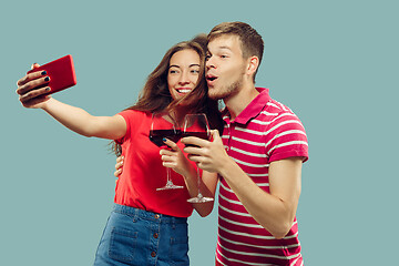 Image showing Beautiful couple isolated on blue studio background