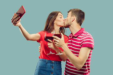 Image showing Beautiful couple isolated on blue studio background