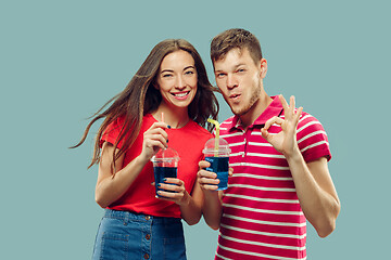 Image showing Beautiful couple isolated on blue studio background