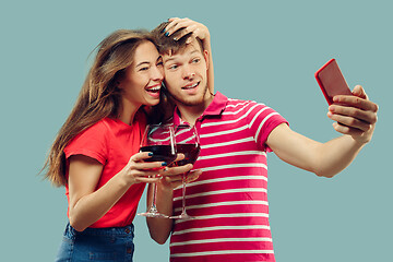 Image showing Beautiful couple isolated on blue studio background