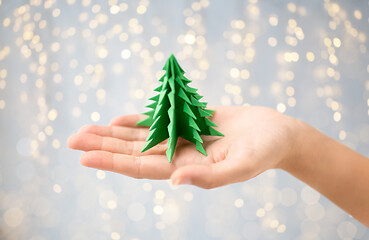 Image showing hand holding green paper origami christmas tree