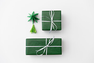Image showing gift boxes and christmas trees on white background