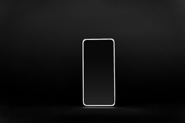 Image showing smartphone with blank screen on black background