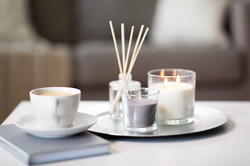 Image showing coffee, candles and aroma reed diffuser on table