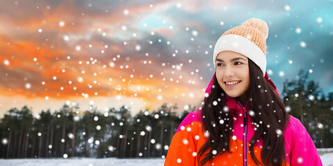 Image showing happy young woman in winter clothes outdoors