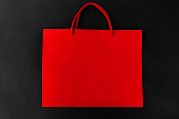 Image showing red shopping bag on black background