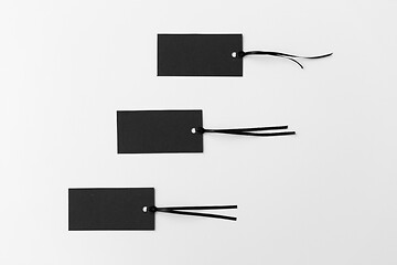 Image showing three black tags on white background