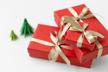 Image showing gift boxes and christmas trees on white background