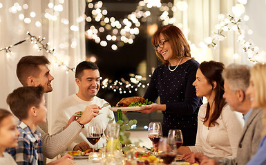 Image showing happy family having dinner party at home