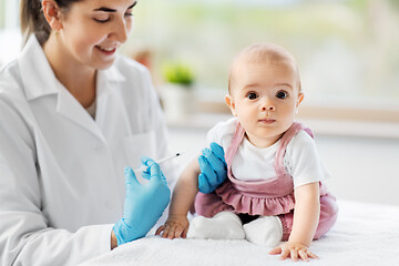 Image showing doctor making vaccine for baby patient at clinic