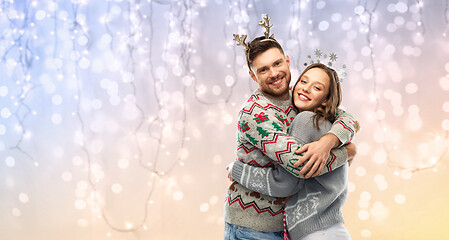 Image showing happy couple at christmas ugly sweater party