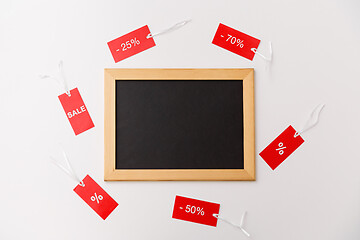 Image showing chalk board and red tags with discount signs