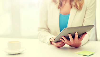 Image showing close up of businesswoman with tablet pc
