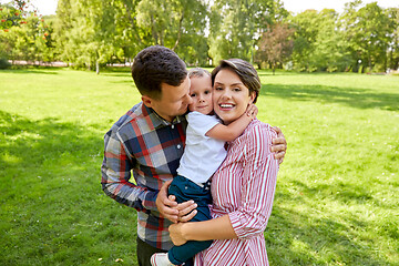 Image showing happy family hugging at summer park