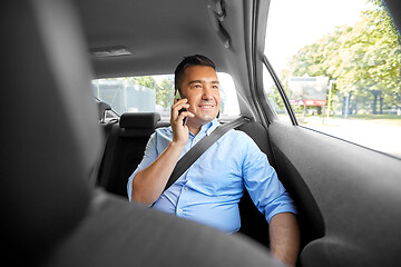 Image showing male passenger calling on smartphone in taxi car