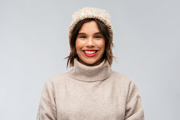 Image showing young woman in knitted winter hat and sweater