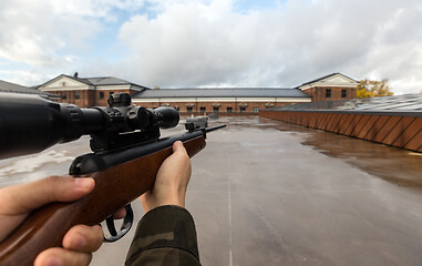 Image showing POV of male hands shooting with air rifle