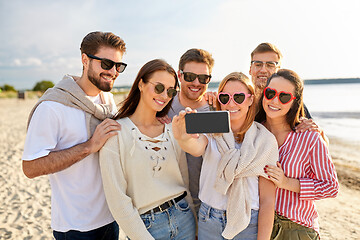 Image showing happy friends taking selfie on summer beach